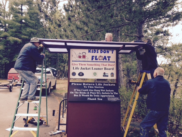 Members building the Life Jacket Loaner Board.